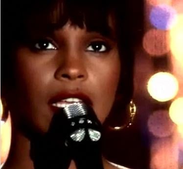Whitney Houston, singing "I Will Always Love You" in her video of the same name